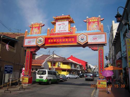a large sign on a city street with cars at Hallmark View Hotel in Melaka