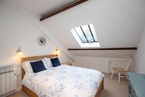 a bedroom with a bed and a skylight at The Gallery in Grasmere