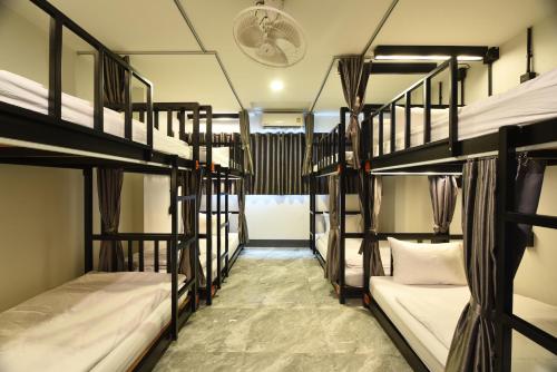 a dorm room with four bunk beds in it at KOKO Party Hostel in Ao Nang Beach