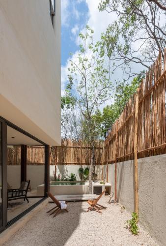 an external view of a patio of a house at Unho Tulum in Tulum