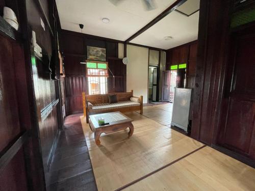 a living room with a couch and a coffee table at Rumah Rehat Anjung Melayu Muslim in Melaka