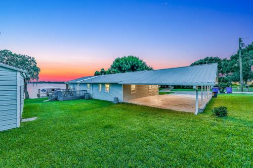 a house with a large yard with a building at Uncork and Unwind You are on Lake Time in Sebring