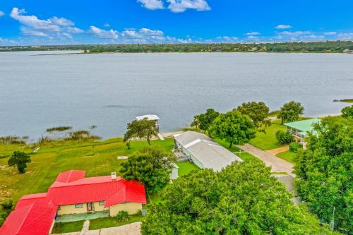 an aerial view of a house next to the water at Uncork and Unwind You are on Lake Time in Sebring