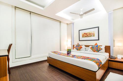 Ένα ή περισσότερα κρεβάτια σε δωμάτιο στο FabHotel Prime Avenue