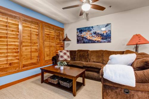 a living room with a couch and a table at Powderhorn Lodge 504 Aspen View Villa in Brighton