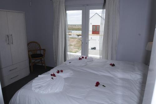 Ein Bett oder Betten in einem Zimmer der Unterkunft Quay West