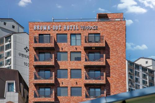 a red brick building with a sign on it at Browndot Terrace Pohang Passenger Terminal in Pohang