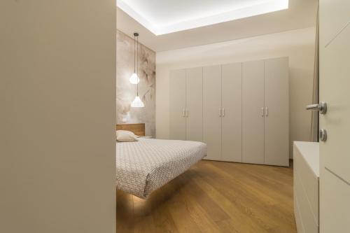 Postel nebo postele na pokoji v ubytování Tuscus Apartments