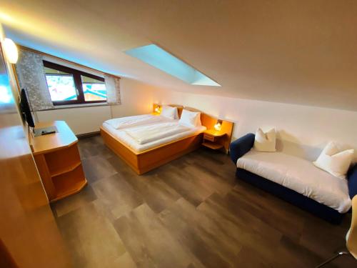 Ένα ή περισσότερα κρεβάτια σε δωμάτιο στο Wellness-Pension Jagahütt'n