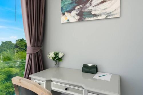 a white desk with a chair and a window at Silver Beach 3br Sea View Pool&Wine Private Villa in Chaweng