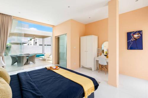 a bedroom with a bed and a living room at Silver Beach 3br Sea View Pool&Wine Private Villa in Chaweng