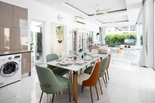 a kitchen and dining room with a table and chairs at Silver Beach 3br Sea View Pool&Wine Private Villa in Chaweng