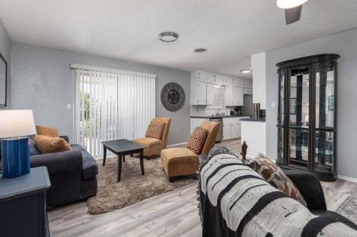 a living room with a couch and chairs and a kitchen at Summer Deal! Air Force 1 Heroes Home - Sheppard AFB Wichita Falls in Wichita Falls