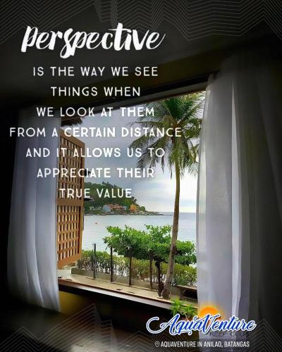 a window with a view of the ocean at Aquaventure Reef Club in Mabini