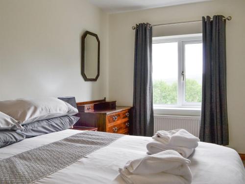 a bedroom with a bed and a window at Shepherds Bield - Uk1349 in Threlkeld