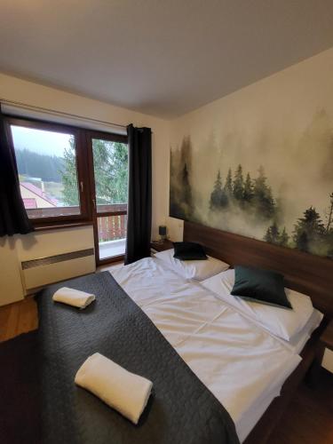 Posteľ alebo postele v izbe v ubytovaní Kamzik Apartment hill view with garage