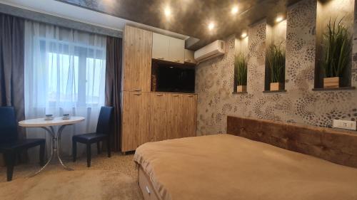 מיטה או מיטות בחדר ב-TOMIS Studio 4B