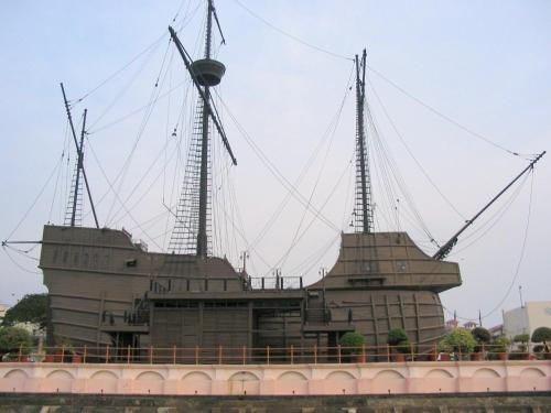 a large building with three windmills on a bridge at Hallmark Express Hotel in Melaka