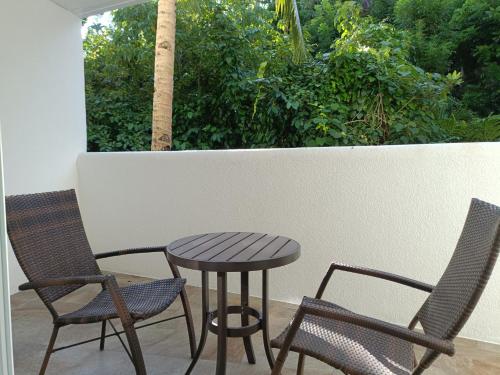a table and two chairs and a table and chairs at Aira Boracay Hotel in Boracay