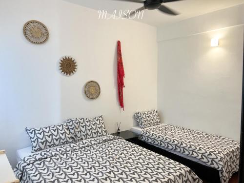 a bedroom with a bed and a chair in it at BayView Suites Port Dickson By MAISON in Port Dickson