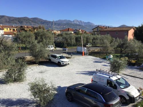 a group of cars parked in a parking lot at Marinella House in Sarzana