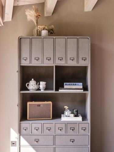 a shelf with a chest of drawers at CERVO Mountain Resort in Zermatt