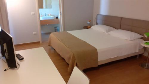 Ένα ή περισσότερα κρεβάτια σε δωμάτιο στο Country House Poggio Alto