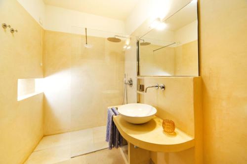 a bathroom with a sink and a shower at Luxury sea villa with pool near SM di Leuca in Castrignano del Capo