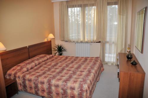 Postel nebo postele na pokoji v ubytování Villa Park Guest Apartments