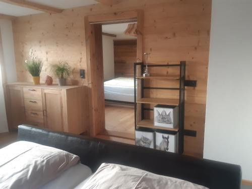 a room with a bed and a room with a bedroom at Hüttenzauber in Taxenbach