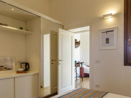 a bedroom with a mirror and a bed in a room at TENUTAYALA - Residenza Agrituristica in Parabita