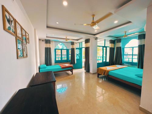 Postel nebo postele na pokoji v ubytování Soul Hostels, Varkala - Black Beach