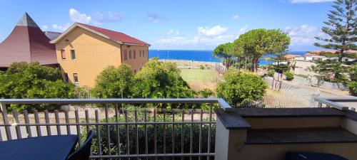 a view of the ocean from a balcony at Casa a Cocca in Briatico