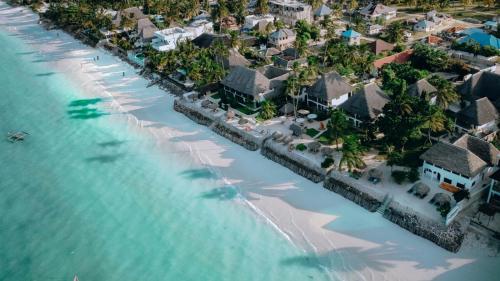 an aerial view of a resort on the beach at Blue Oyster Hotel in Jambiani