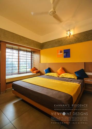 Una cama o camas en una habitación de Nirvana Home stay TVM -allure