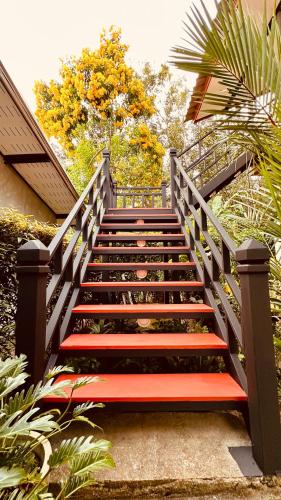 a set of stairs with a red bench on them at Hanoii House in Ko Mak