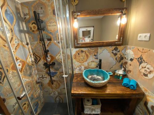 a bathroom with a sink and a shower at Hilltop Hideout in Szentendre