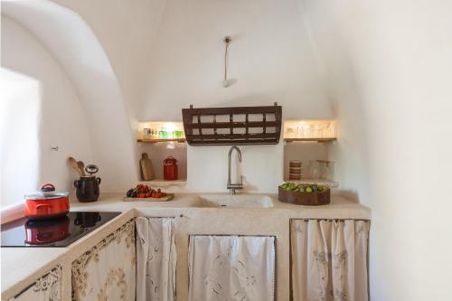 Kuchyň nebo kuchyňský kout v ubytování Trulli 18cinquantanove