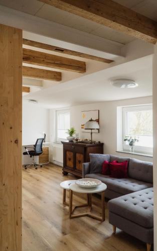 a living room with a couch and a table at Wohnen auf Zeit in Weingarten in Weingarten