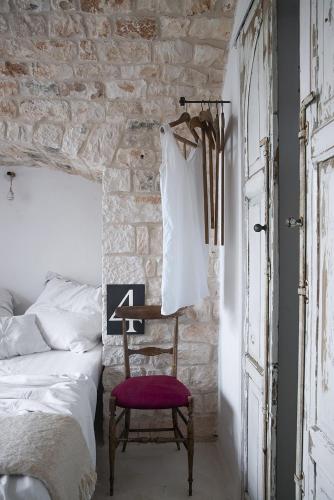 Postel nebo postele na pokoji v ubytování Trulli 18cinquantanove
