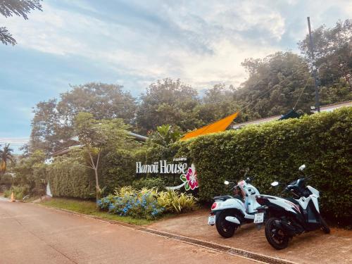 a motorcycle parked on the side of a street at Hanoii House in Ko Mak