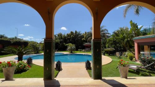 a view of a swimming pool from a building at Riad Noumidya in Fès