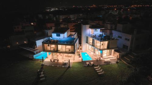 an aerial view of a large house at night at Mythical Villas Zeus and Venus in Protaras