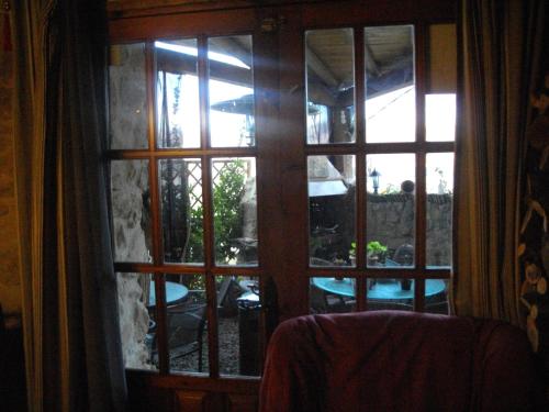 a window with a view of a patio outside at Ca la Serreta in Cretas