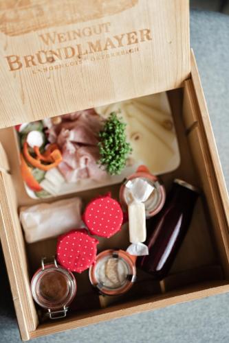 a wooden box filled with different types of food at MÜHLENHOF ROOMS boutique bed & breakfast in Langenlois