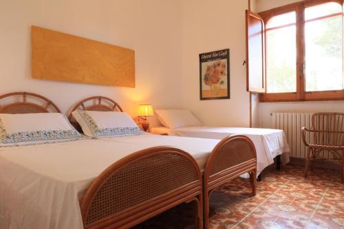 Ένα ή περισσότερα κρεβάτια σε δωμάτιο στο Villa Oltremare