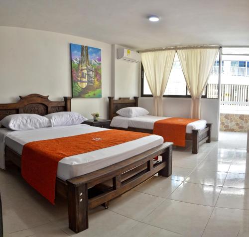 a hotel room with two beds at Apartamento con vista al mar en el Rodadero in Santa Marta