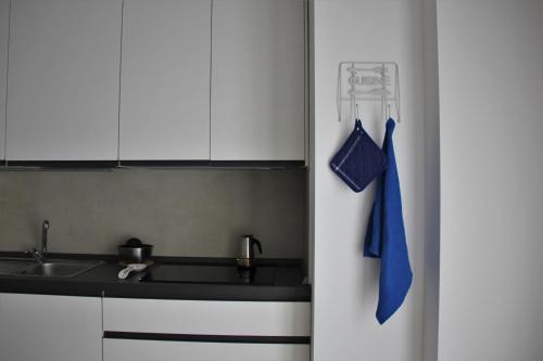 a kitchen with a sink and a white refrigerator at New apartment close to the Cinque Terre in La Spezia
