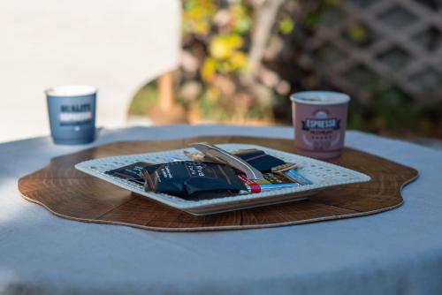 a plate of food on a wooden tray on a table at Livadi cozy villa in Arachova