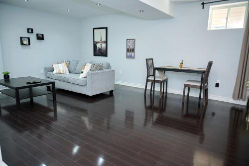 a living room with a couch and a table at Peace Alcove in Milton